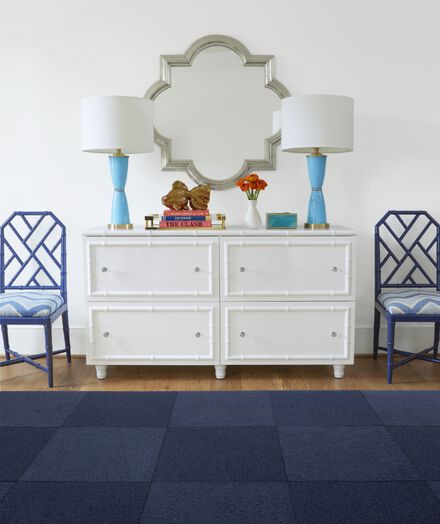 Dresser with lamps and FLOR Heaven Sent area rug shown in Indigo.